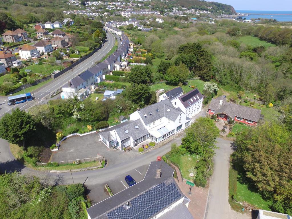 an aerial view of a village with houses and a road at Ivybridge Guesthouse in Fishguard