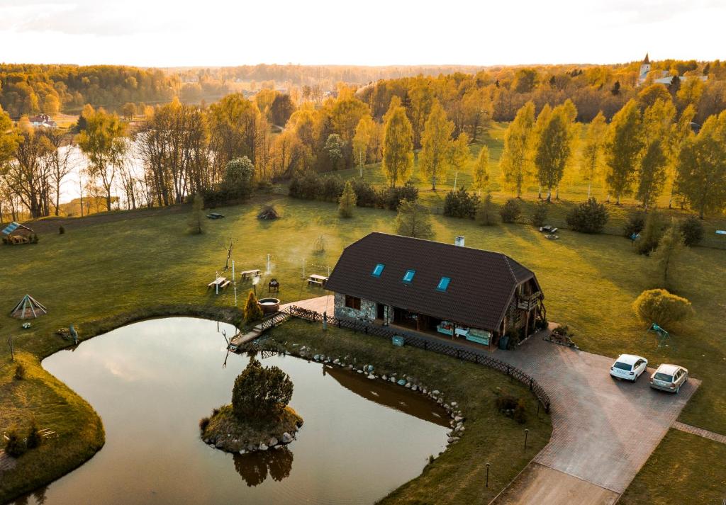 an aerial view of a house with a pond at Tindioru Holiday House in Rõuge