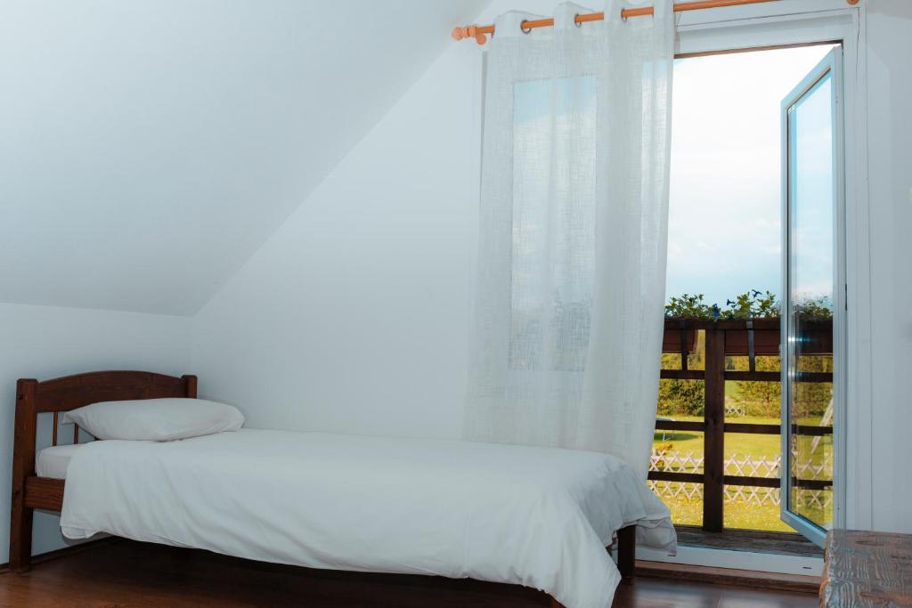 Postel nebo postele na pokoji v ubytování Tindioru Holiday House