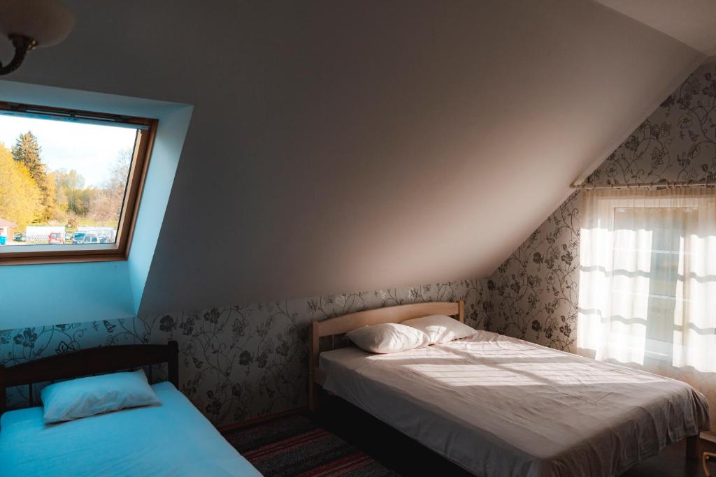 Postel nebo postele na pokoji v ubytování Tindioru Holiday House