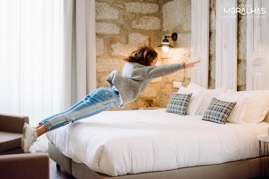 Cama ou camas em um quarto em Casa das Muralhas