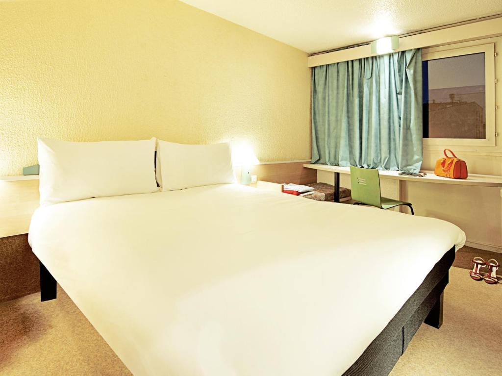 Postel nebo postele na pokoji v ubytování Hotel ibis Guimaraes