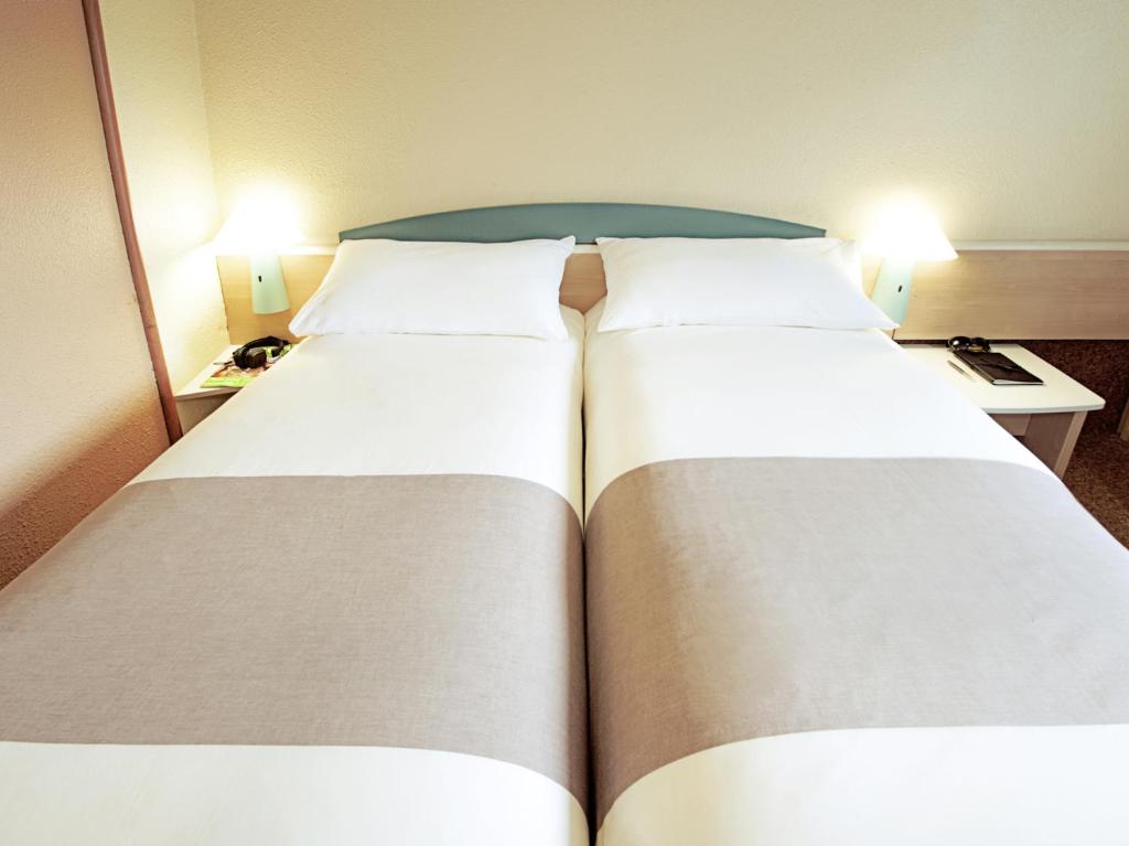 Postel nebo postele na pokoji v ubytování Hotel ibis Guimaraes