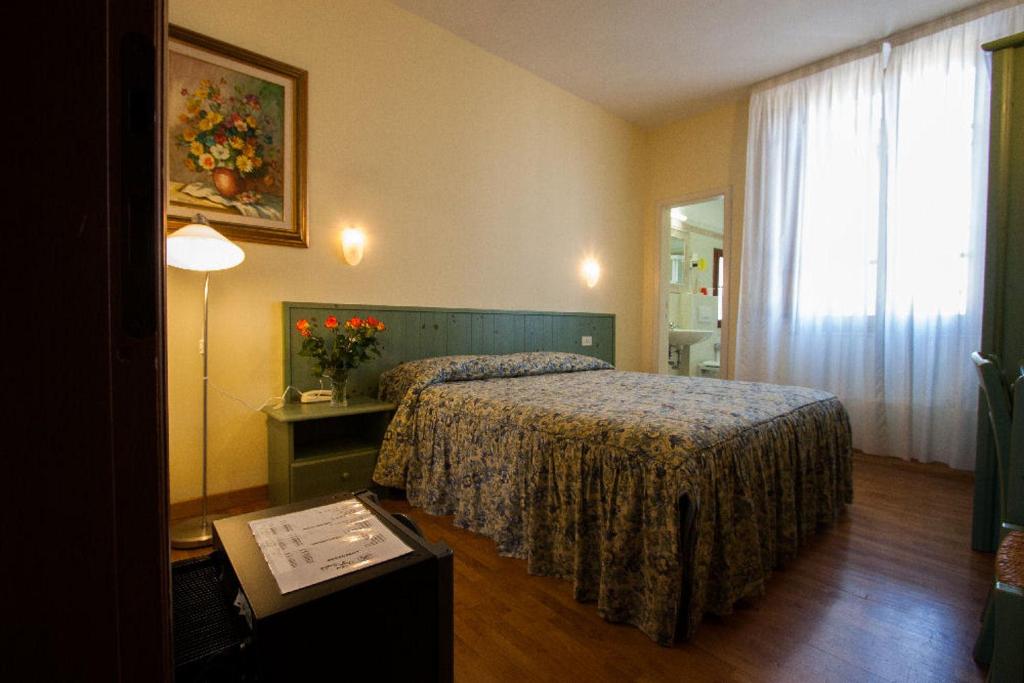 Postel nebo postele na pokoji v ubytování Hotel Savoia e Campana