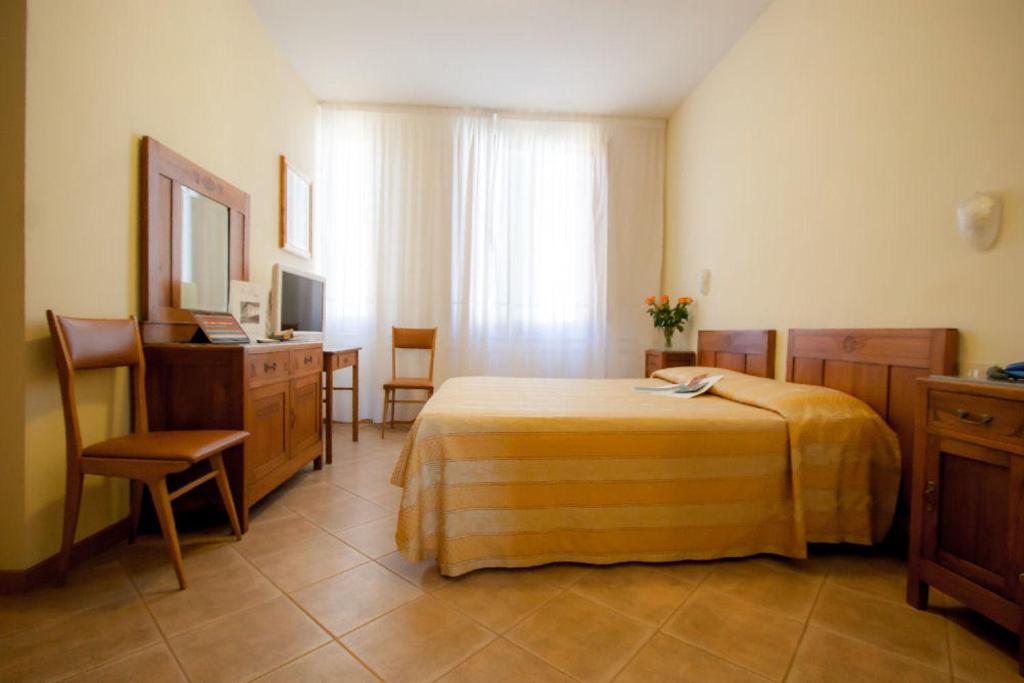 Postel nebo postele na pokoji v ubytování Hotel Savoia e Campana