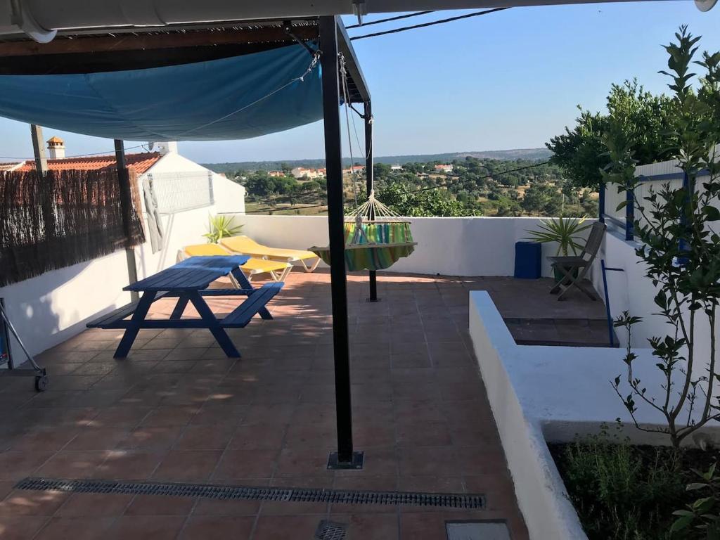 a view from the roof of a house with a picnic table at Sabores Alem Tejo 38 in Montargil