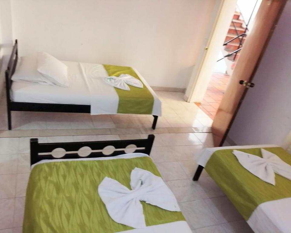 Postel nebo postele na pokoji v ubytování Hotel Tame Real