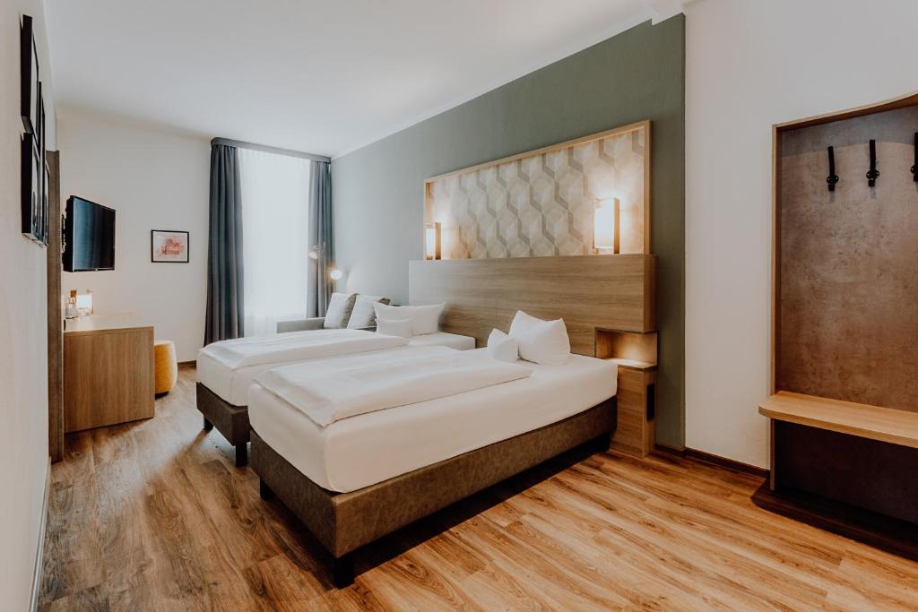 Postel nebo postele na pokoji v ubytování Hotel Westerkamp