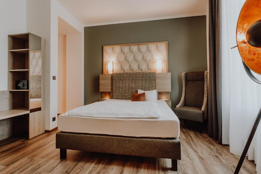 Postel nebo postele na pokoji v ubytování Hotel Westerkamp