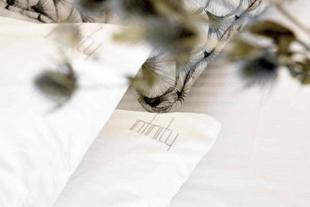 Łóżko lub łóżka w pokoju w obiekcie Star Infinity Suites