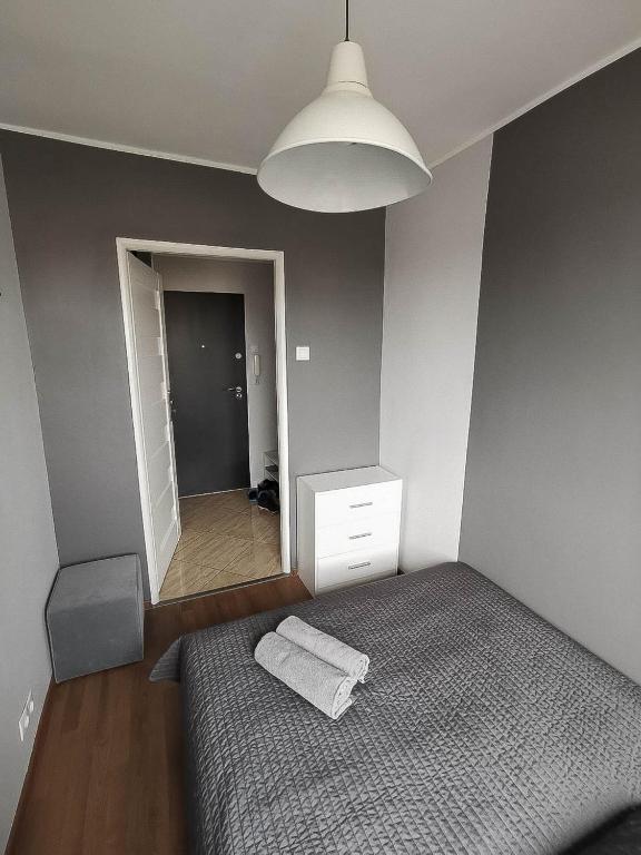 Posteľ alebo postele v izbe v ubytovaní Sky Apartments - Łagiewniki