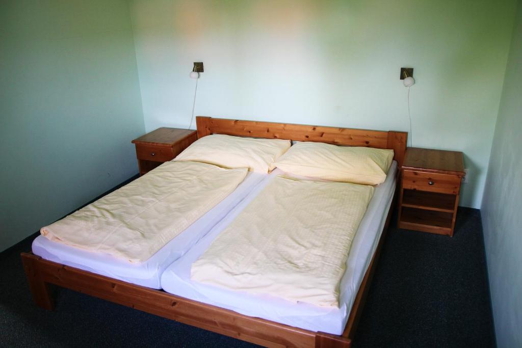 Postel nebo postele na pokoji v ubytování Schneeberg Apartmany