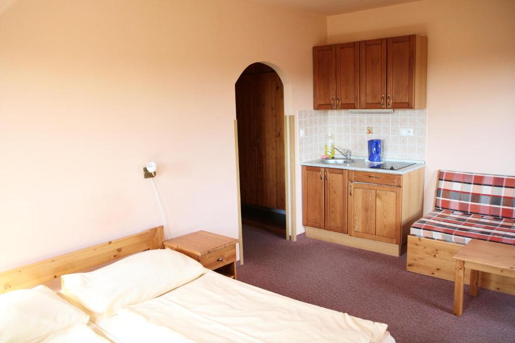 Postel nebo postele na pokoji v ubytování Schneeberg Apartmany