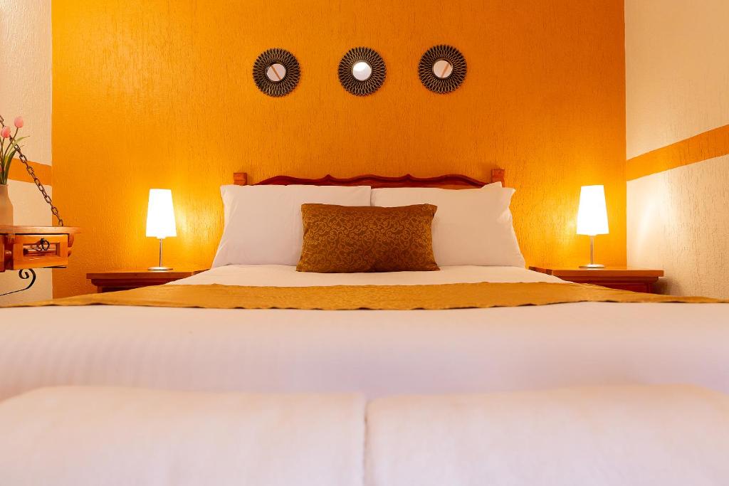 Postel nebo postele na pokoji v ubytování Casablanca Hotel Tula