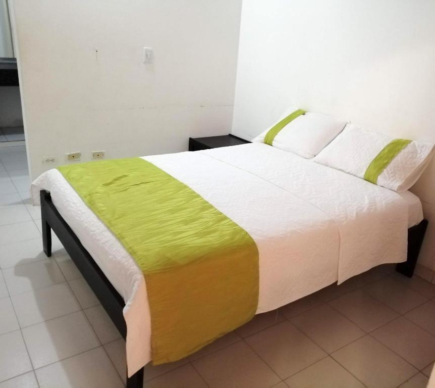 Postel nebo postele na pokoji v ubytování Hotel Tame Real