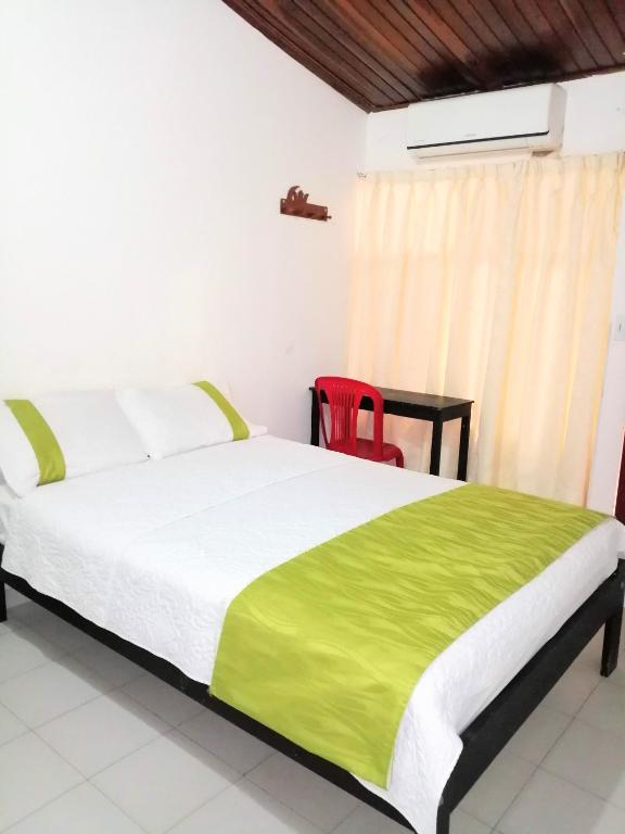 Postel nebo postele na pokoji v ubytování Hotel Tame Real