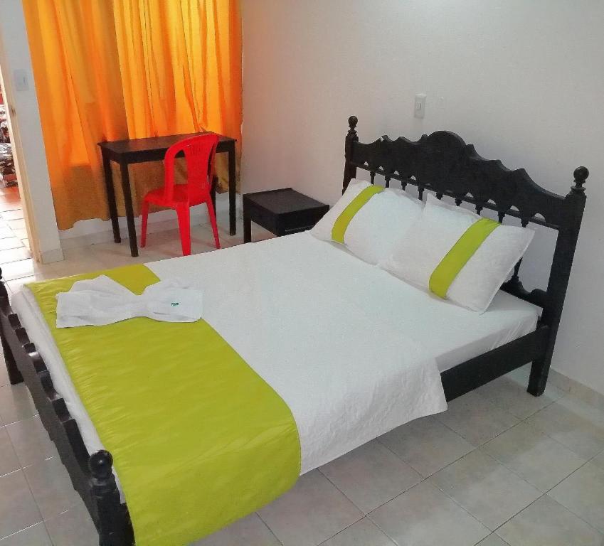 Postel nebo postele na pokoji v ubytování Hotel Tame Real