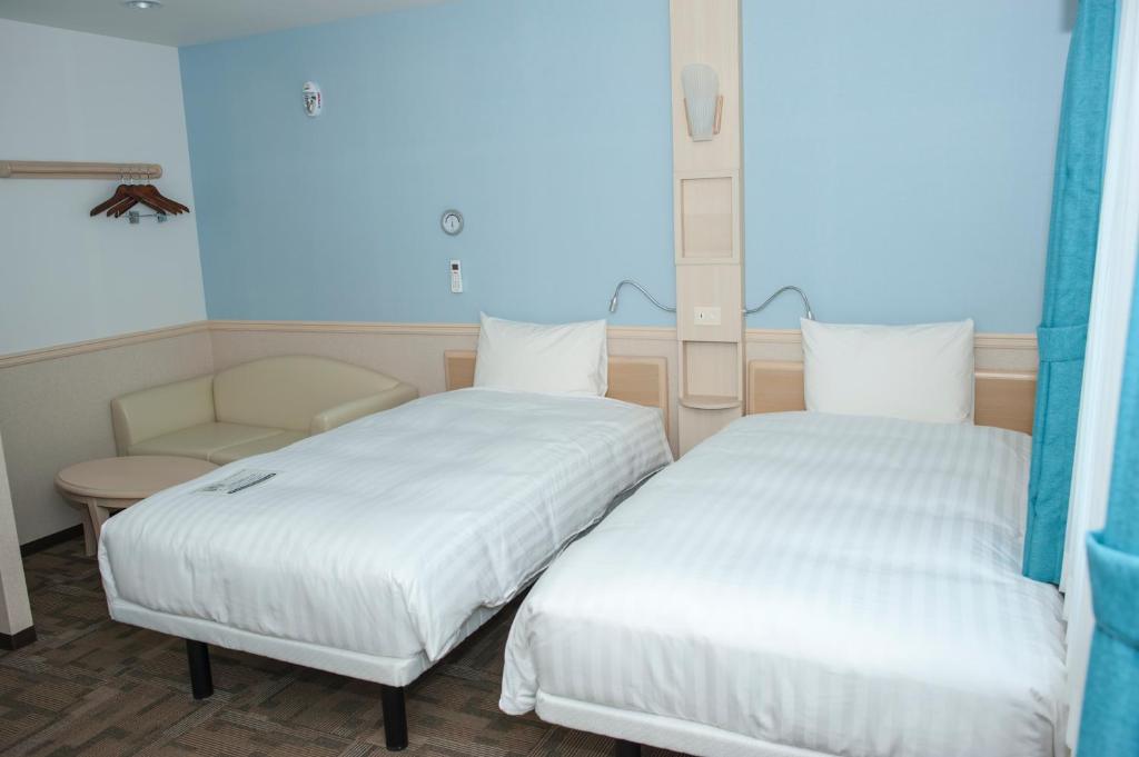 Postel nebo postele na pokoji v ubytování Toyoko Inn Daegu Dongseongro
