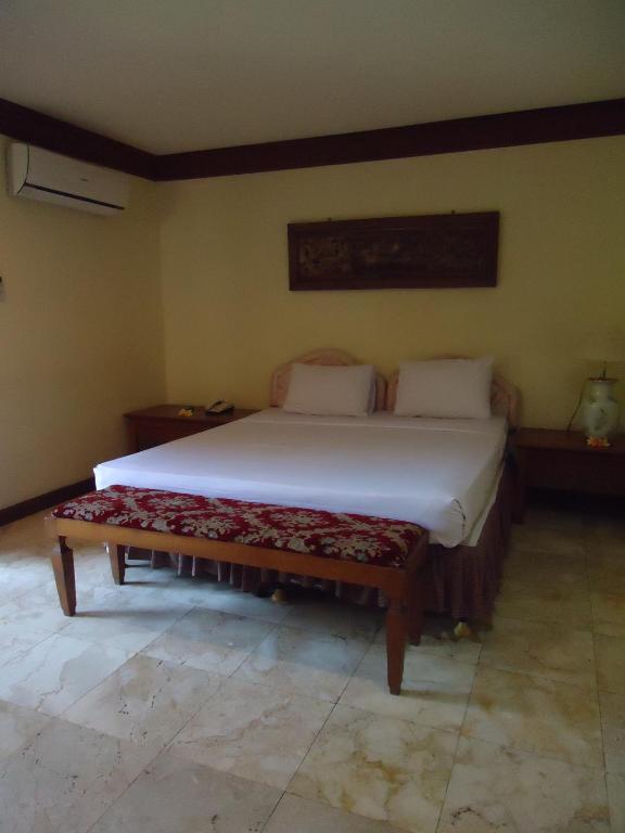 Postel nebo postele na pokoji v ubytování Ananda Resort Seminyak