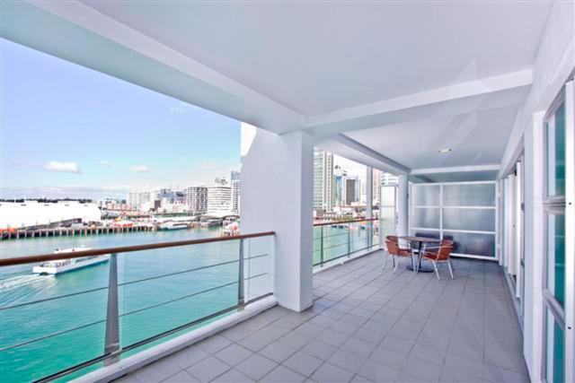 a balcony of a building with a view of the water at QV Stunning 2 Bed Condo - 378 in Auckland