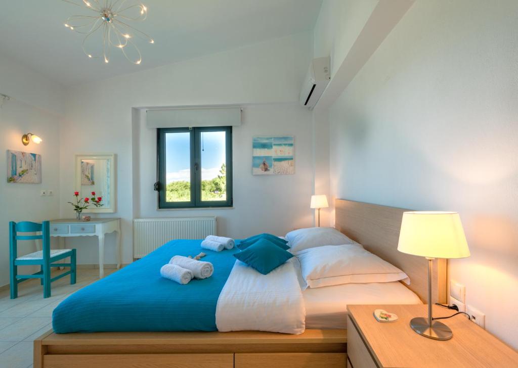 A bed or beds in a room at Nefeli Villas