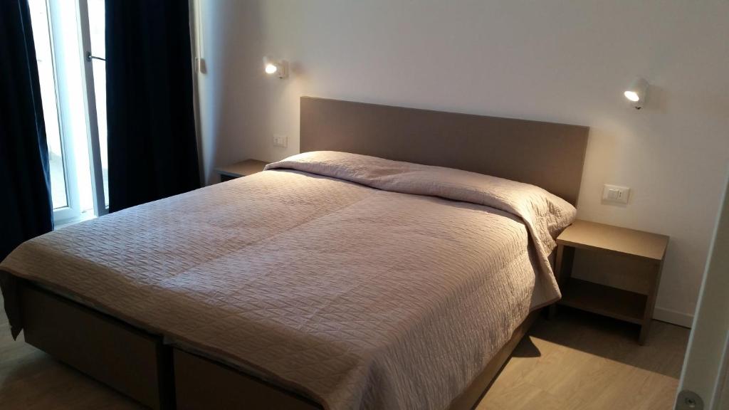 Llit o llits en una habitació de Hotel Stella Polare