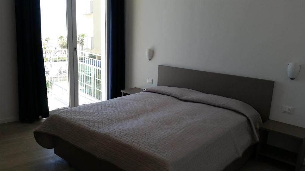 Llit o llits en una habitació de Hotel Stella Polare