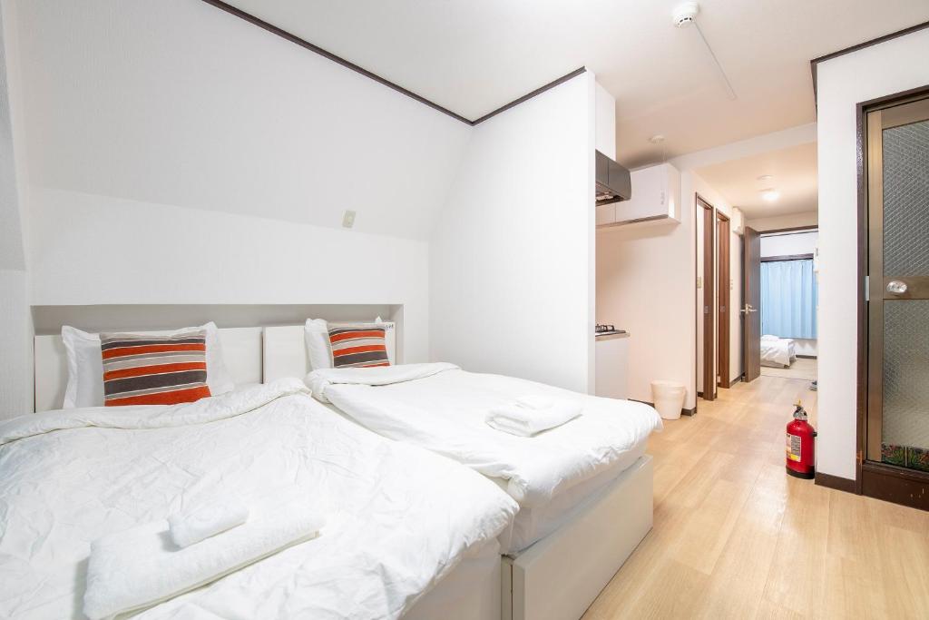 Postel nebo postele na pokoji v ubytování Uhome Tabata Apartment