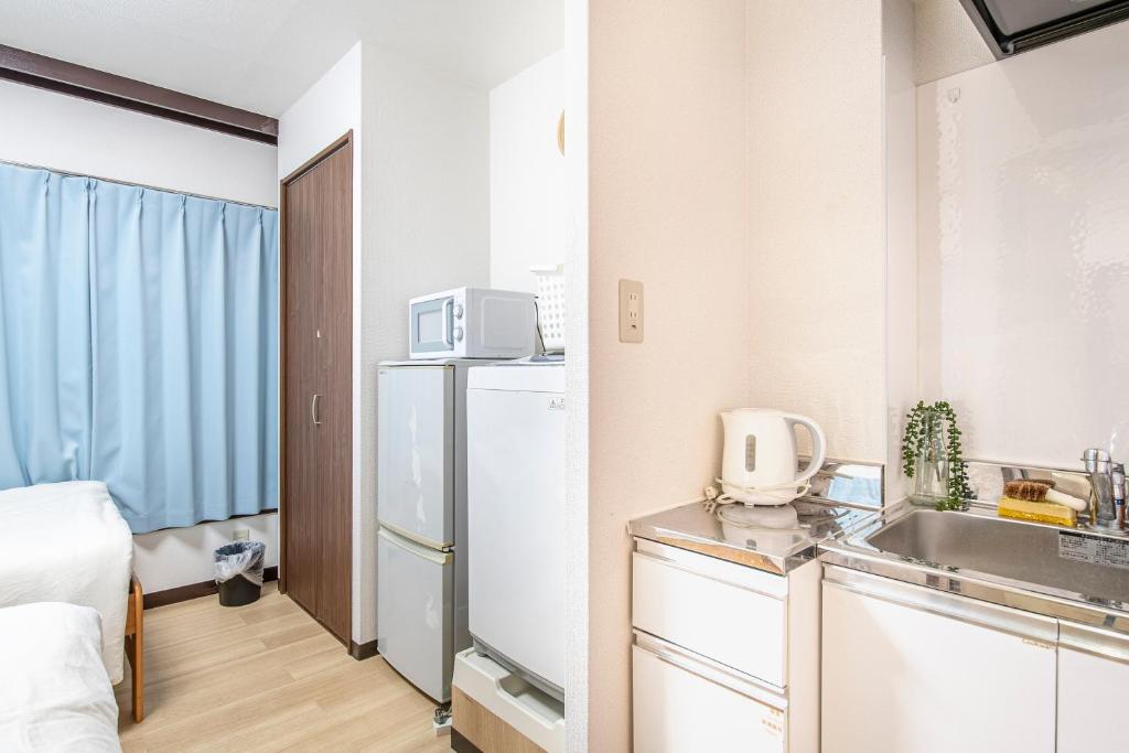 Kuchyň nebo kuchyňský kout v ubytování Uhome Tabata Apartment