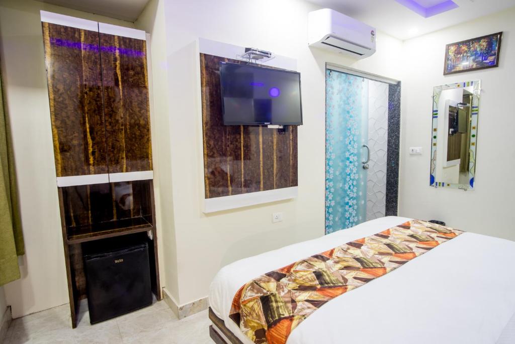 Postel nebo postele na pokoji v ubytování Delhi Guest House at New Delhi Railway Station