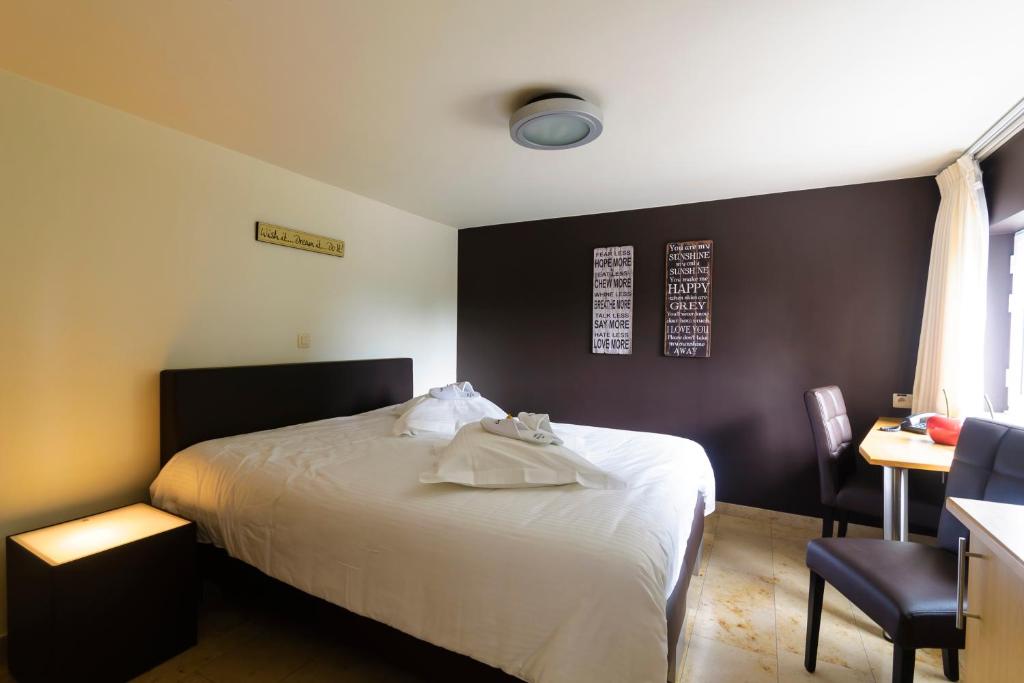 Postel nebo postele na pokoji v ubytování Hotel Pracha
