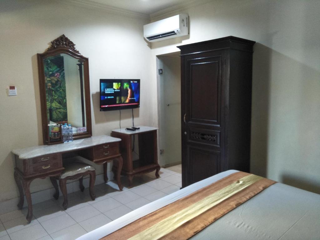 TV a/nebo společenská místnost v ubytování Hotel Grand Rosela