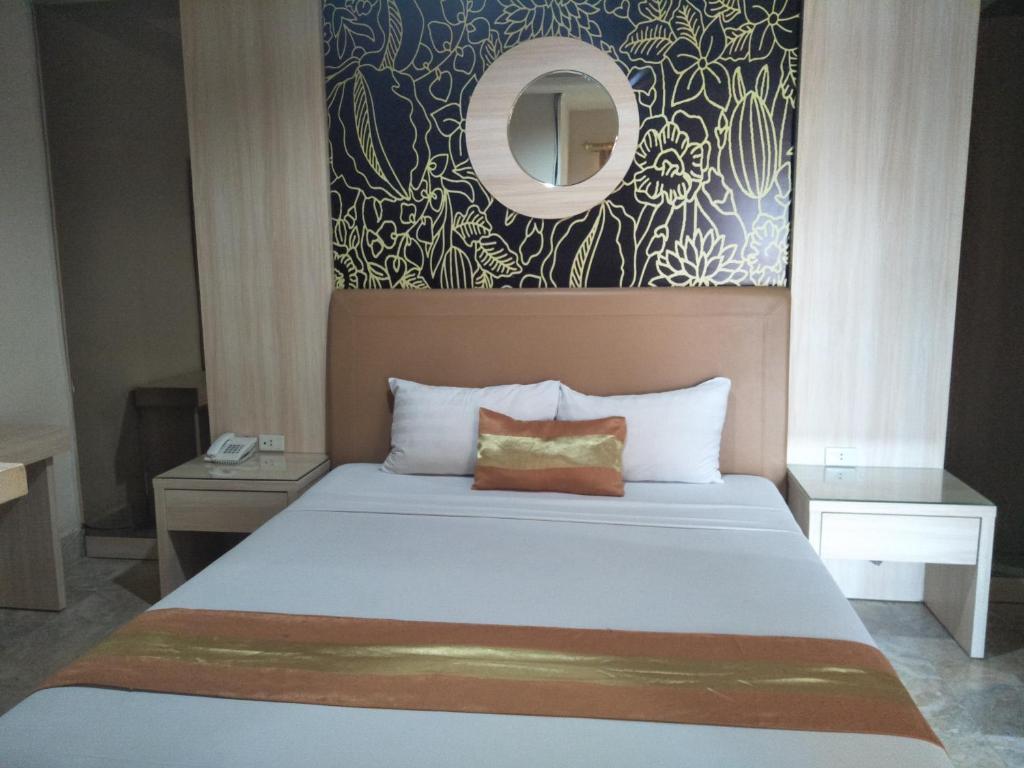 Postel nebo postele na pokoji v ubytování Hotel Grand Rosela