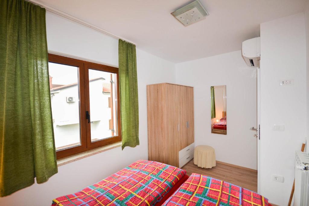 Postel nebo postele na pokoji v ubytování Jutta Apartment