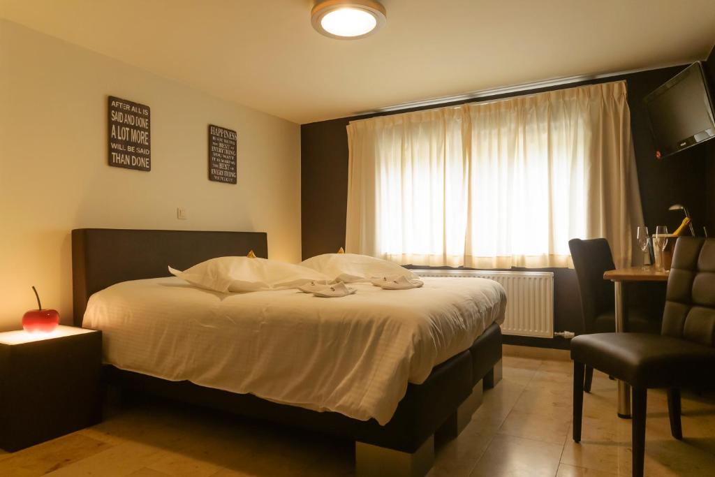 Postel nebo postele na pokoji v ubytování Hotel Pracha