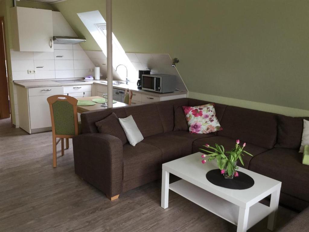 a living room with a couch and a table at Haus Fabricius in Tating