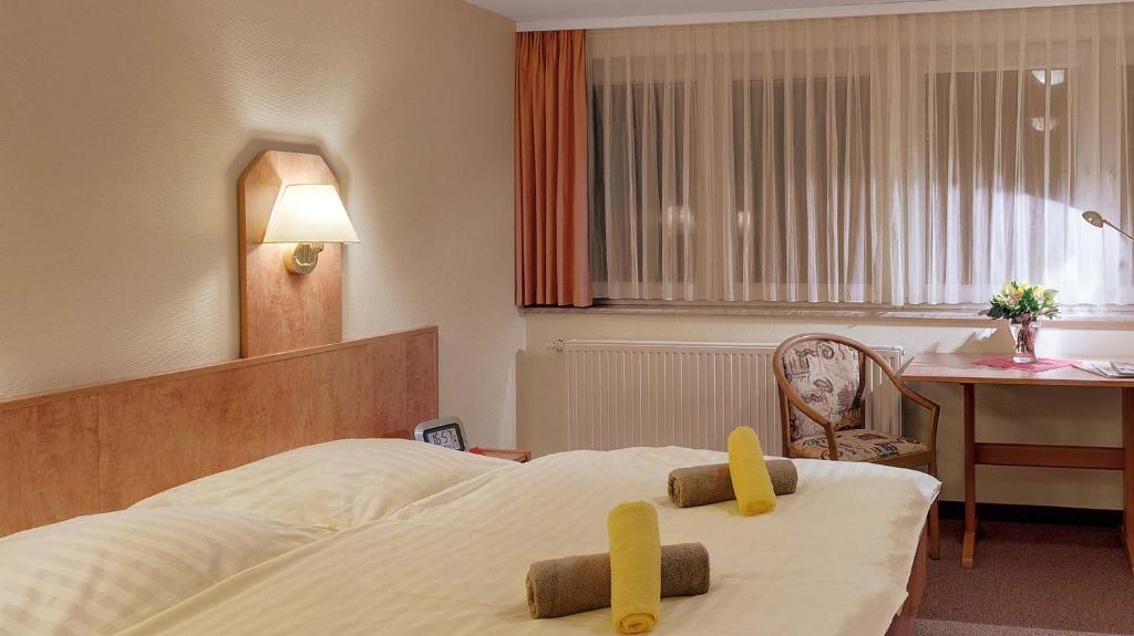 Letto o letti in una camera di Hotel Thüringenschanze