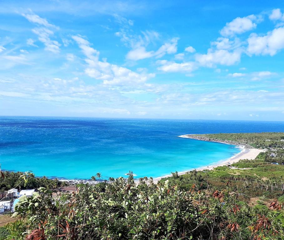 a view of a beach and the ocean at SkyeBay Club in Hengchun