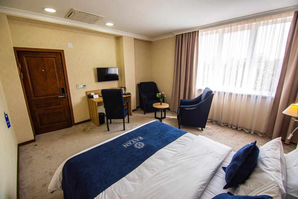 Postel nebo postele na pokoji v ubytování Rayan Hotel
