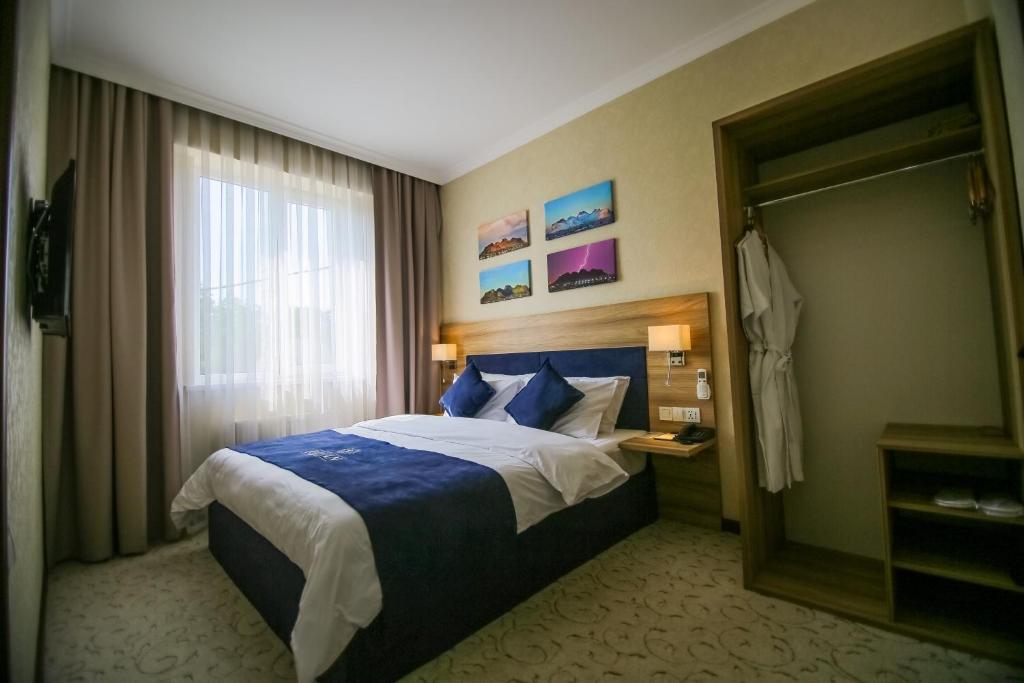 Postel nebo postele na pokoji v ubytování Rayan Hotel