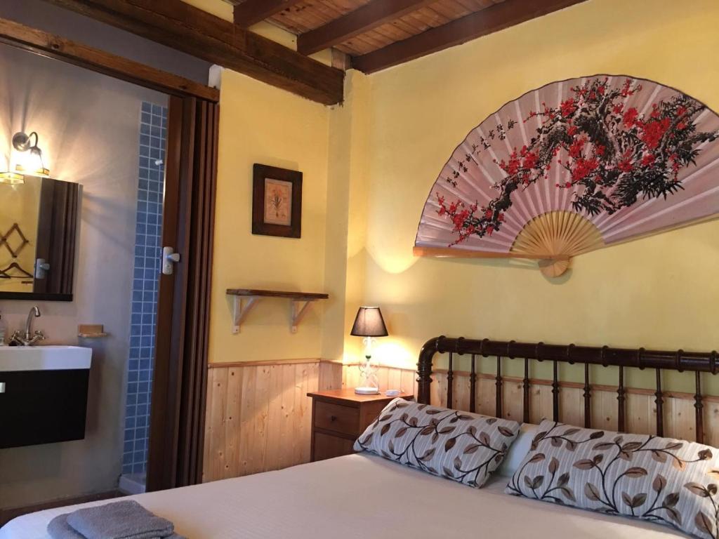 Posteľ alebo postele v izbe v ubytovaní La Casa del Abuelo Simón