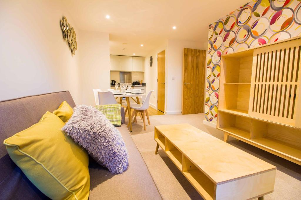 a living room with a couch and a table at Open Key Apartments in Liverpool