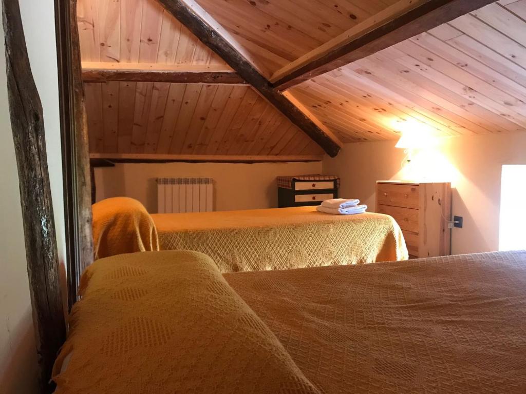 Posteľ alebo postele v izbe v ubytovaní La Casa del Abuelo Simón