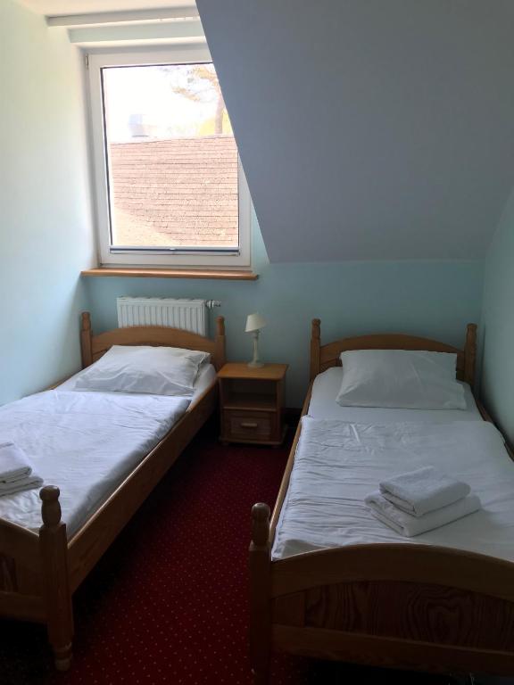 Postel nebo postele na pokoji v ubytování Zajazd Dajana