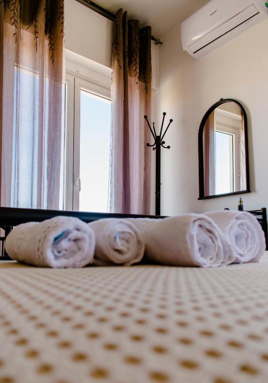 Postel nebo postele na pokoji v ubytování Nikolakakis Rooms Lavrio