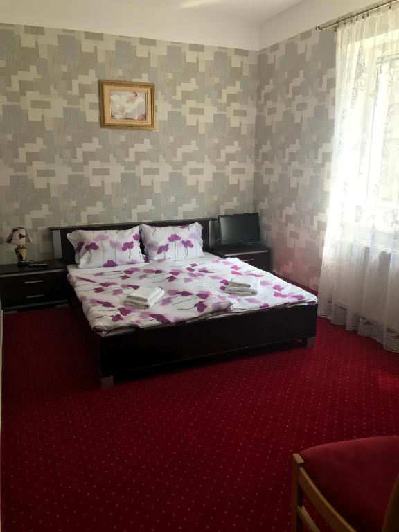 Postel nebo postele na pokoji v ubytování Zajazd Dajana