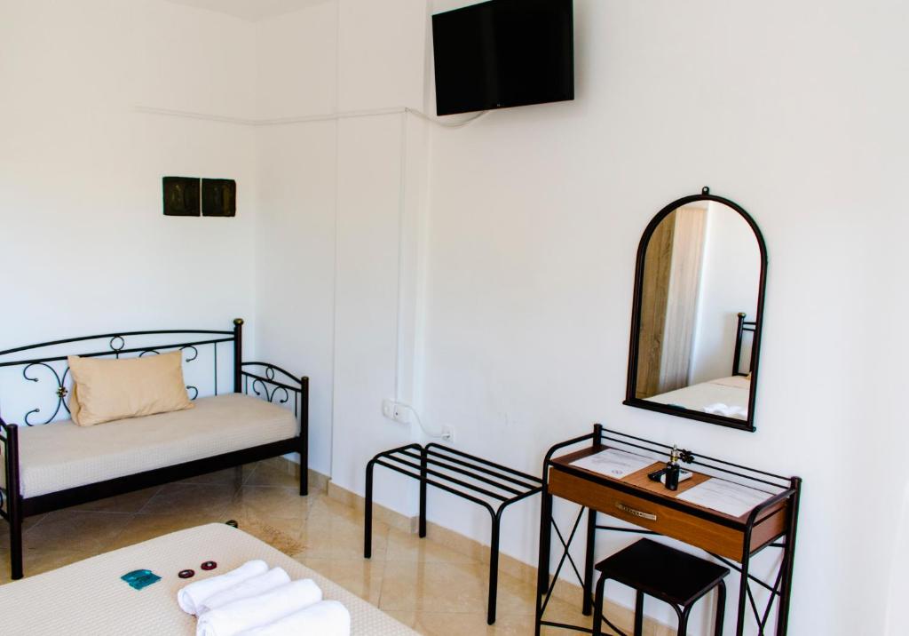 Postel nebo postele na pokoji v ubytování Nikolakakis Rooms Lavrio