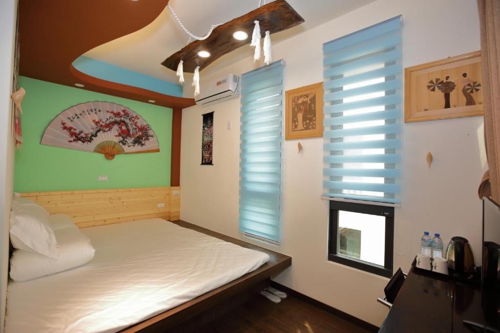 Postel nebo postele na pokoji v ubytování DuGu Hostel
