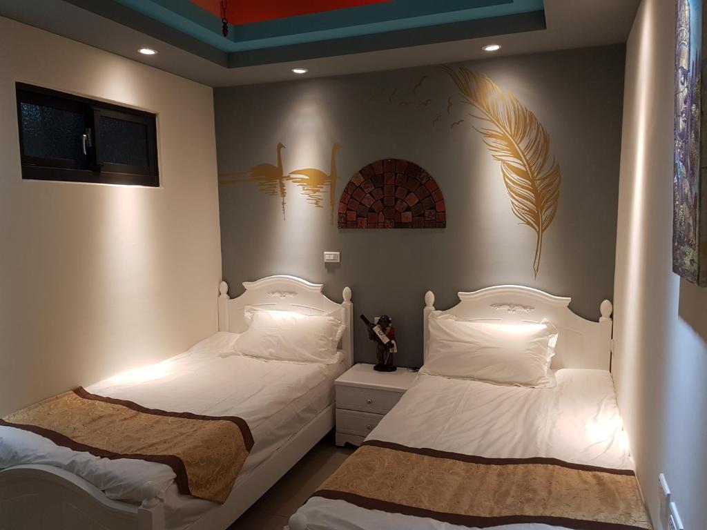 Postel nebo postele na pokoji v ubytování DuGu Hostel
