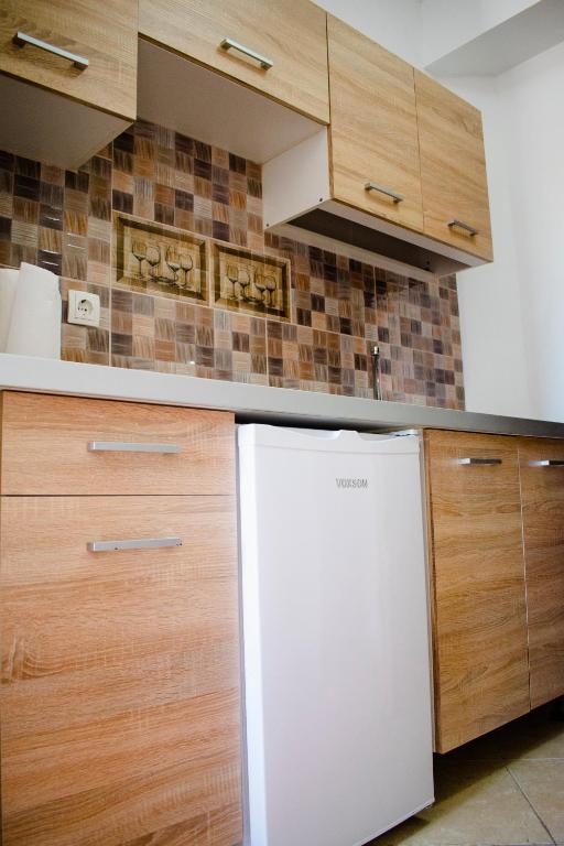 Kuchyň nebo kuchyňský kout v ubytování Nikolakakis Rooms Lavrio